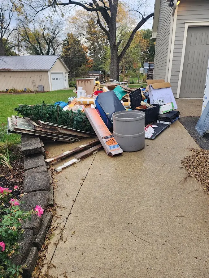 Dumpster being loaded with debris for Roofing Dumpster Rental in Stanford